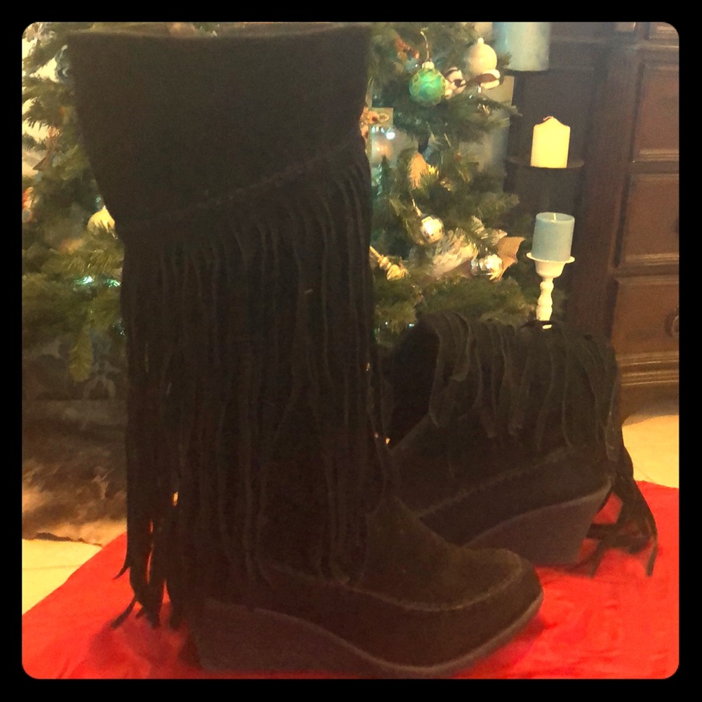 Knee high fringe boots